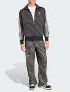 Giacca Adidas Monogram Loose Firebird KC9158 nera uomo vista frontale