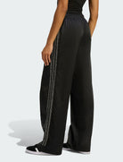 Vista laterale pantaloni Adidas Pearl Firebird KC7863 neri donna